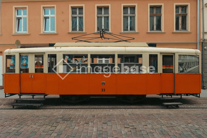 Vintage Tram on Cobbled Street