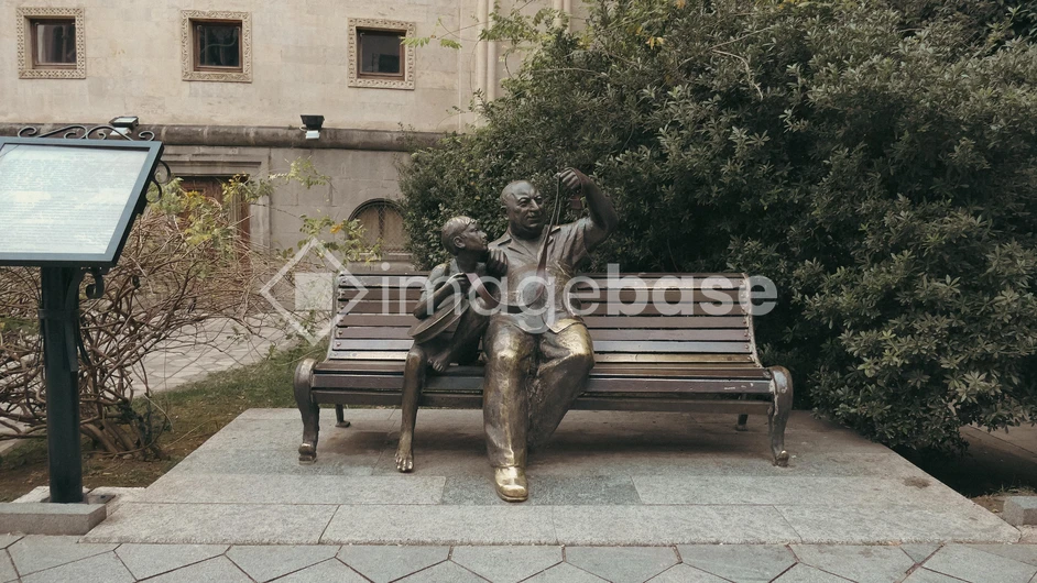 Bronze Statue on a Bench