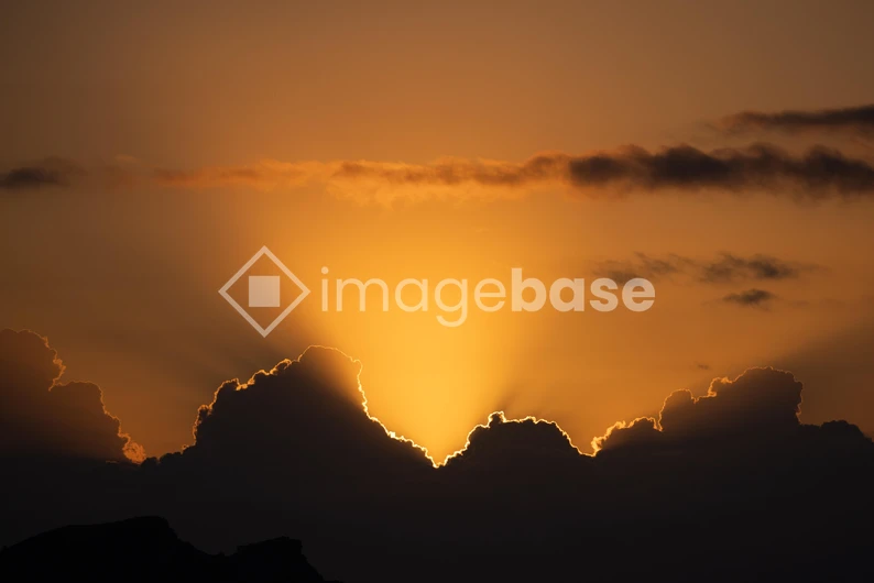 Sunset Behind Clouds