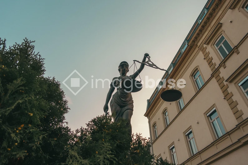 Statue of Justice in Urban Setting