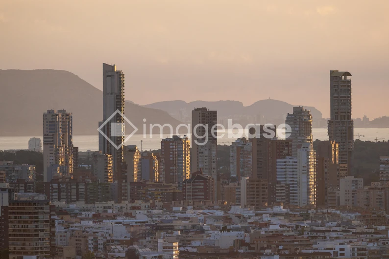 Sunset Cityscape with Mountains